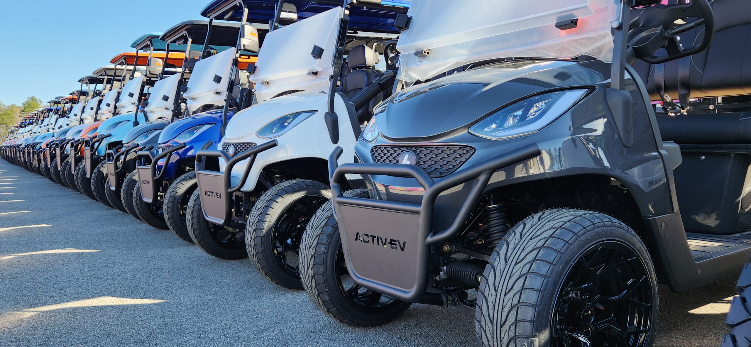 ActivEV lithium golf carts lined up outdoors